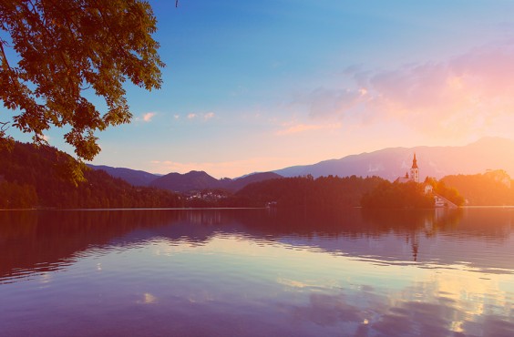 Calm Bled lake at sunrise